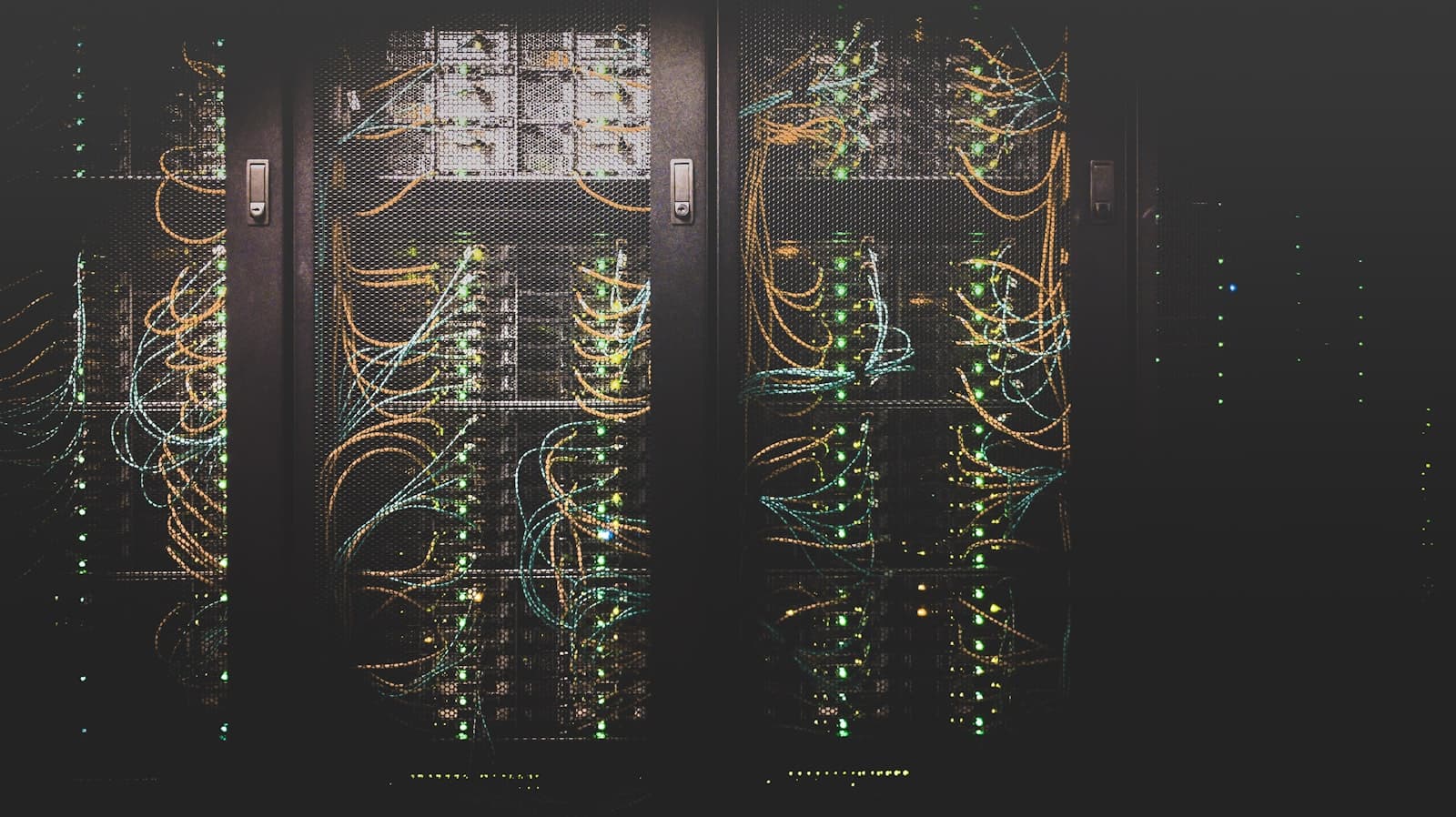 Server racks with structured cabling and status lights in a data center